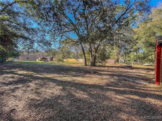 view of yard with fence