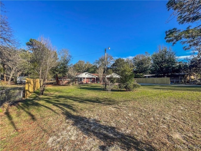 view of yard with fence