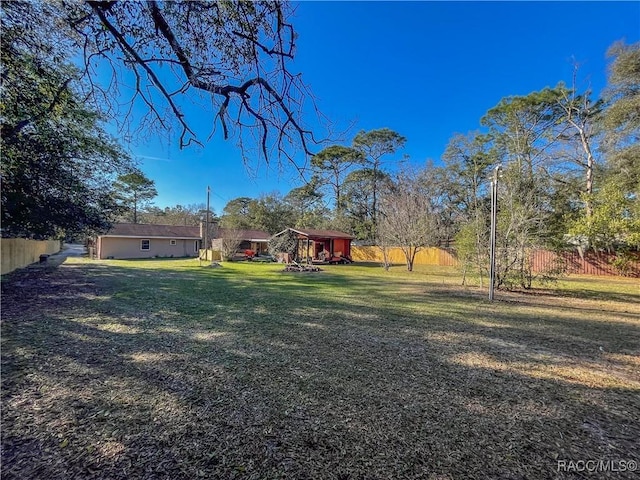 view of yard featuring fence