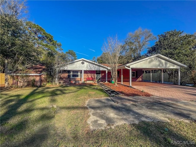 ranch-style home with driveway, a front yard, and fence