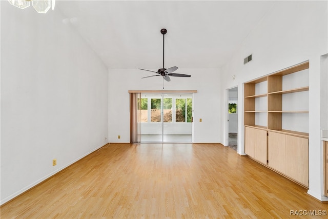 unfurnished living room featuring ceiling fan, lofted ceiling, and light hardwood / wood-style flooring