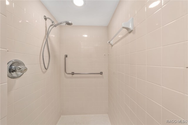 bathroom with a tile shower