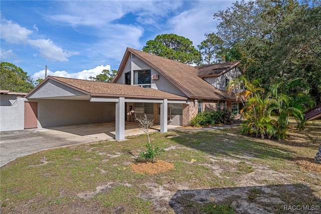 exterior space with a lawn and a carport