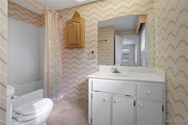 full bathroom with vanity, toilet, and shower / bath combo with shower curtain