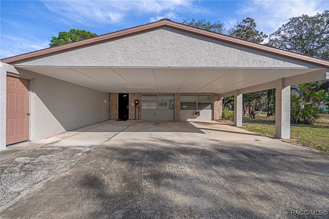 view of car parking featuring a carport