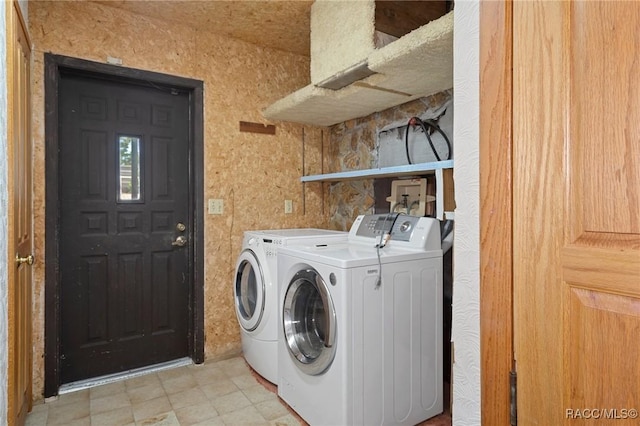 laundry area featuring washing machine and clothes dryer