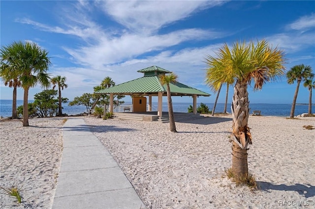 view of property's community featuring a gazebo and a water view