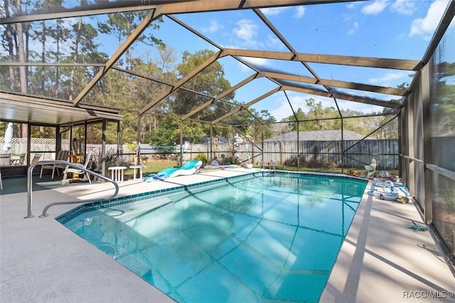 view of pool featuring a fenced in pool, a patio, a fenced backyard, and glass enclosure