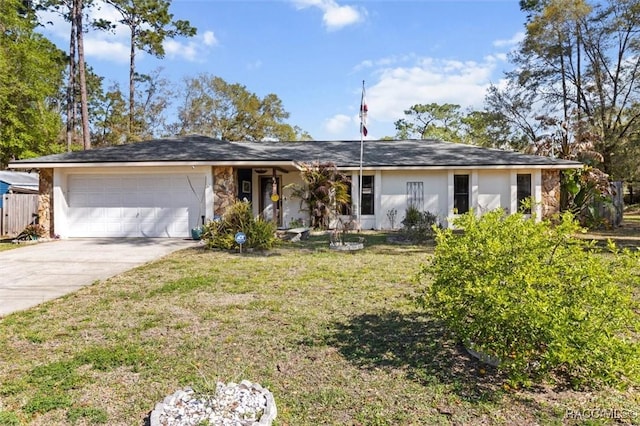 ranch-style house featuring stucco siding, a front yard, an attached garage, and driveway