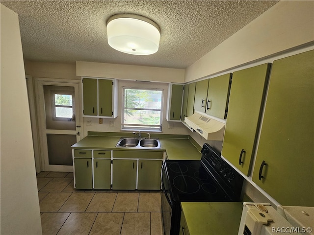 kitchen with extractor fan, sink, light tile patterned floors, black electric range oven, and green cabinets