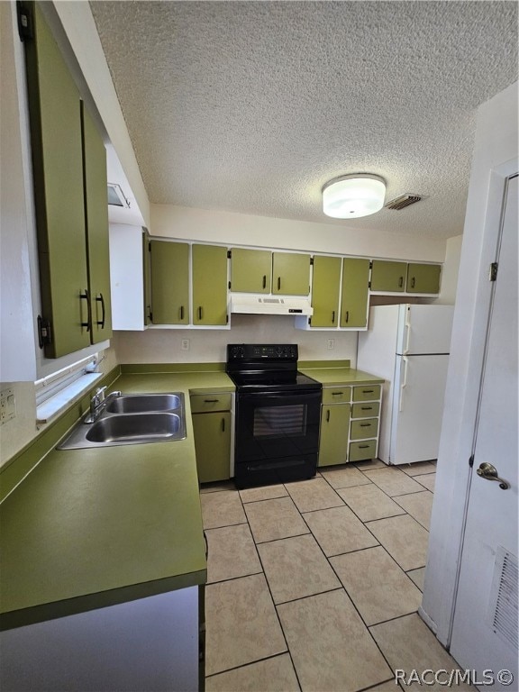 kitchen with green cabinets, white refrigerator, sink, black electric range, and a textured ceiling