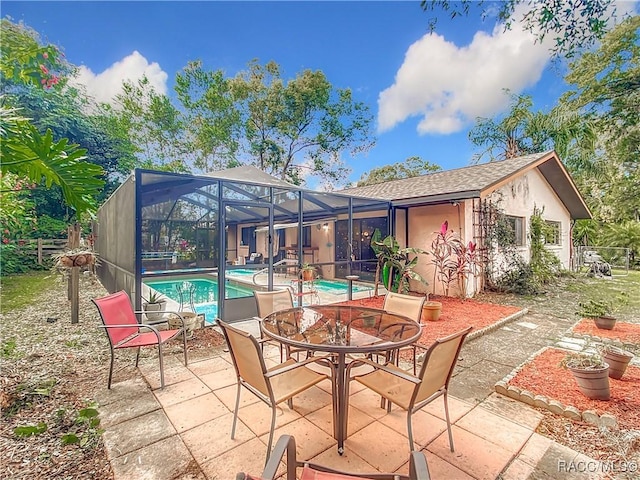 view of patio / terrace with a lanai