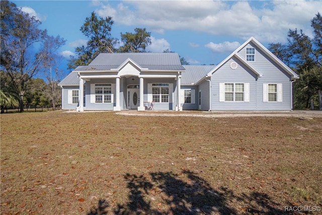 view of front of property with covered porch and a front lawn