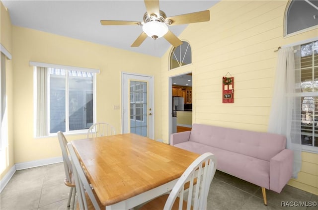 dining room with light tile patterned floors and ceiling fan