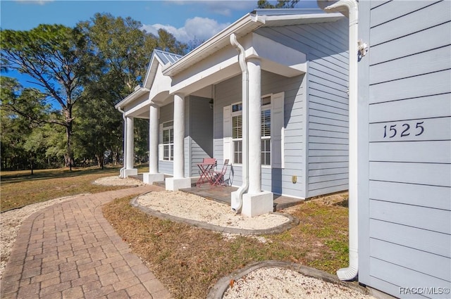 doorway to property featuring covered porch