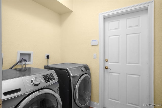 washroom featuring independent washer and dryer