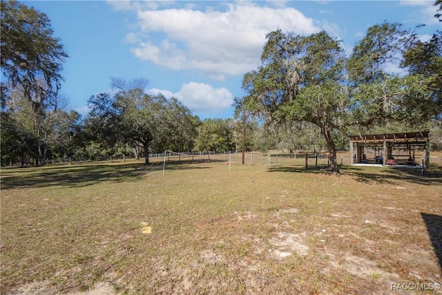 view of yard with a rural view