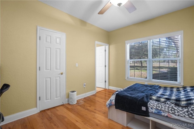 bedroom featuring hardwood / wood-style floors and ceiling fan