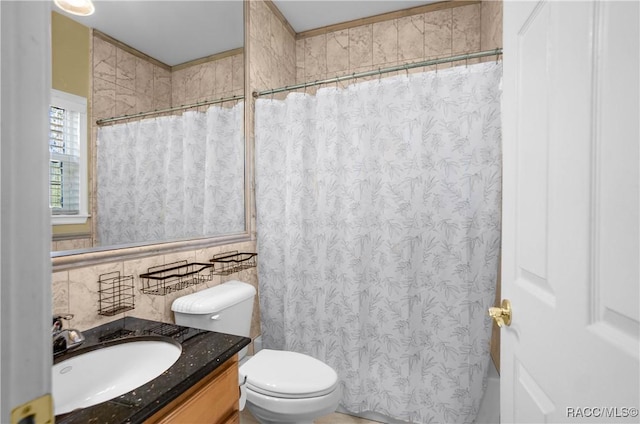 bathroom featuring vanity, curtained shower, and toilet