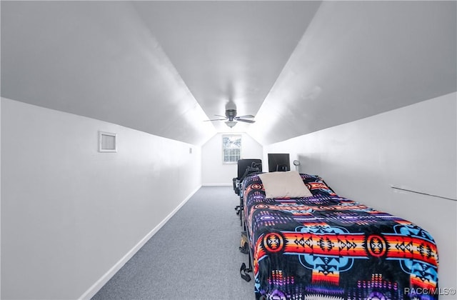 bedroom featuring ceiling fan, vaulted ceiling, and carpet