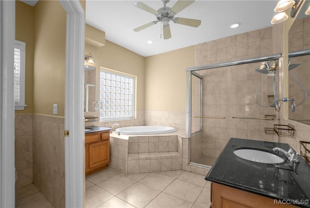 bathroom with tile patterned flooring, shower with separate bathtub, vanity, and ceiling fan