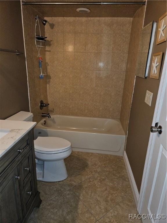 full bath featuring tile patterned flooring, bathtub / shower combination, vanity, and toilet