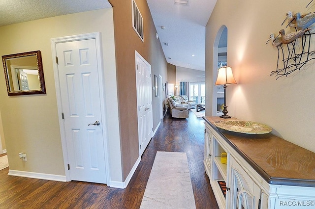 11938 W Blue Bayou Ct Unit 331, Crystal River, FL 34429 - corridor with dark wood-style floors, baseboards, arched walkways, and visible vents