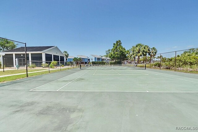 11938 W Blue Bayou Ct Unit 331, Crystal River, FL 34429 - view of tennis court with fence