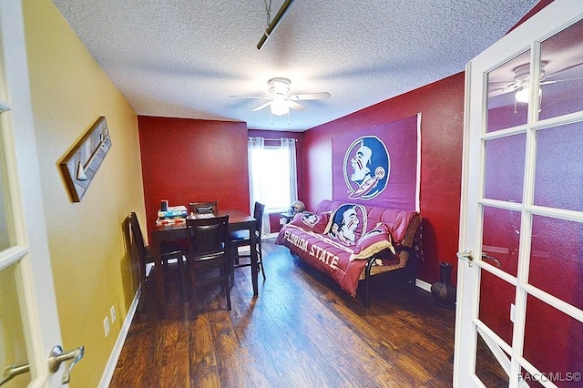 11938 W Blue Bayou Ct Unit 331, Crystal River, FL 34429 - living room featuring a textured ceiling, ceiling fan, wood finished floors, and baseboards