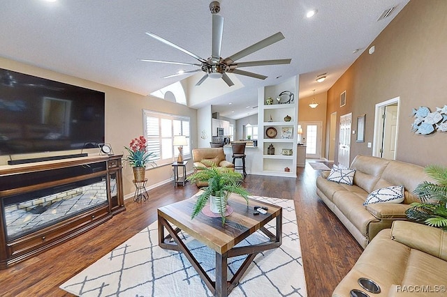 11938 W Blue Bayou Ct Unit 331, Crystal River, FL 34429 - living room with wood finished floors, visible vents, a ceiling fan, a textured ceiling, and lofted ceiling