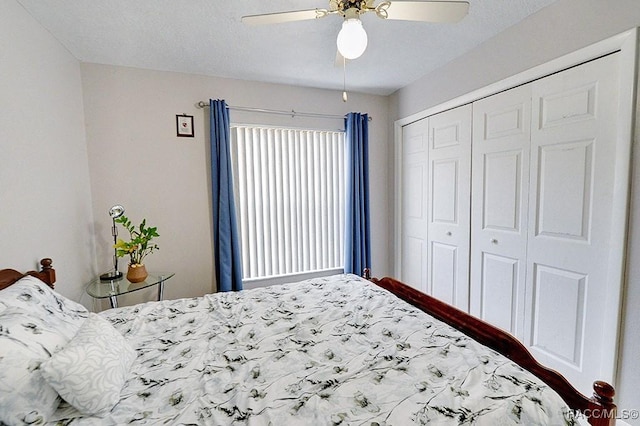 bedroom with ceiling fan and a closet