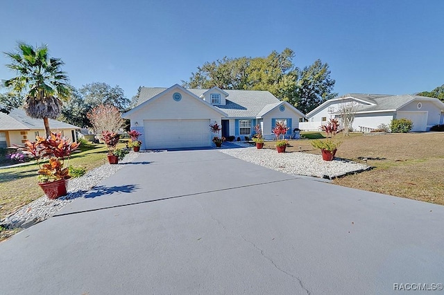 view of front facade featuring a front lawn and a garage