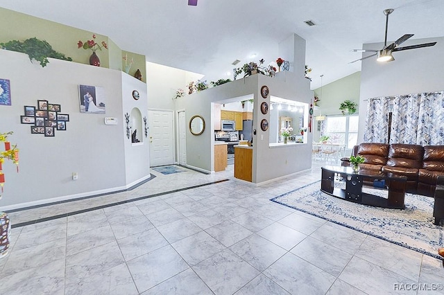 living room featuring high vaulted ceiling and ceiling fan