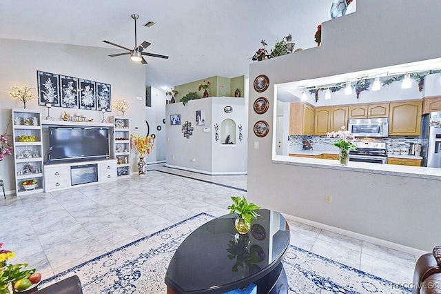 living room with ceiling fan and lofted ceiling