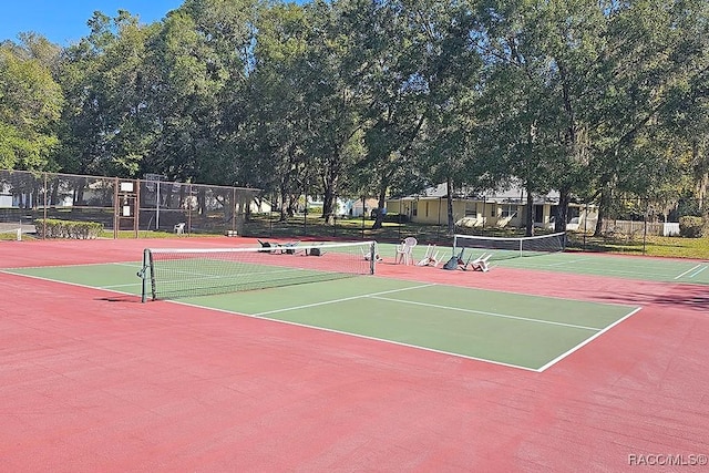 view of sport court with basketball hoop