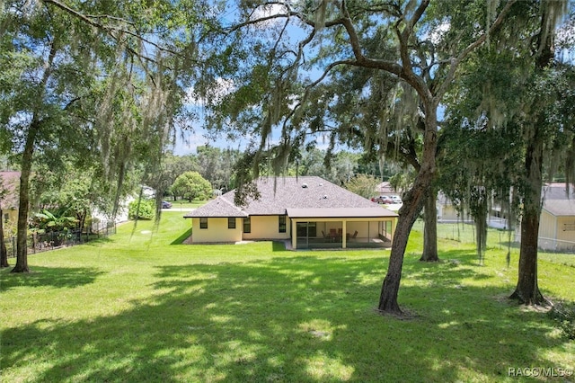 view of yard with a sunroom