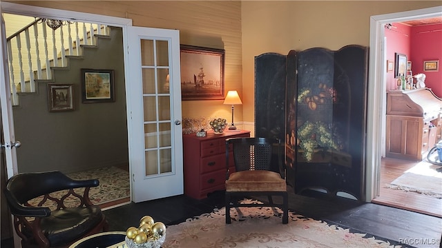 living area featuring french doors and dark hardwood / wood-style flooring