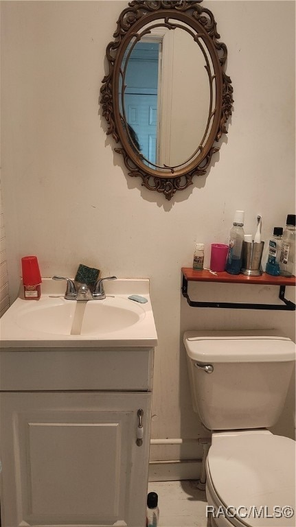 bathroom with vanity and toilet