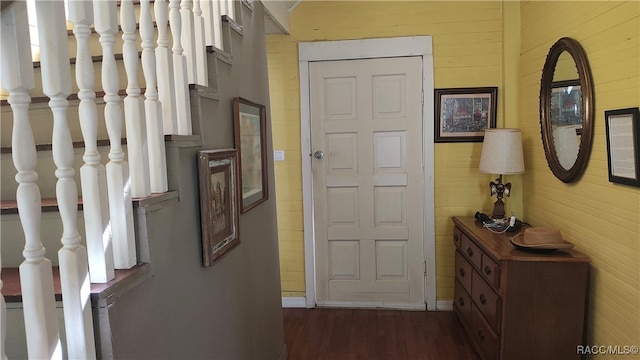 hall with dark hardwood / wood-style floors