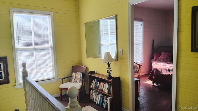 interior space featuring hardwood / wood-style floors and wood walls