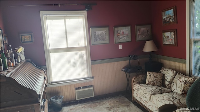 bedroom with an AC wall unit