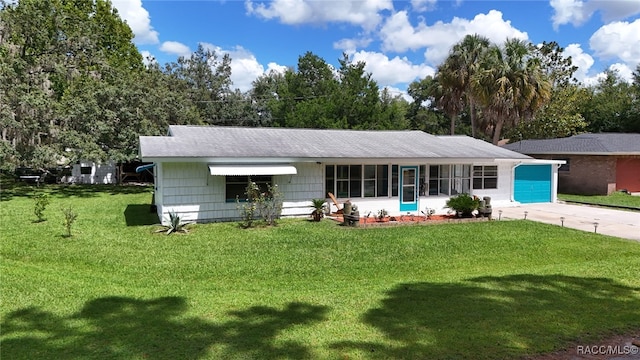 view of front facade with a garage and a front lawn