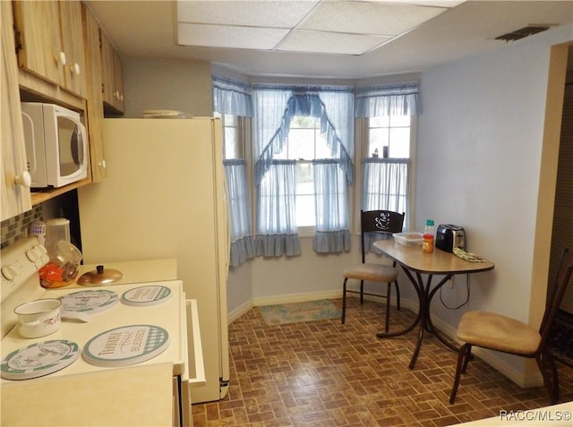 3966 N Spanish Moss Pt, Beverly Hills, FL 34465 - dining area with brick patterned flooring and baseboards