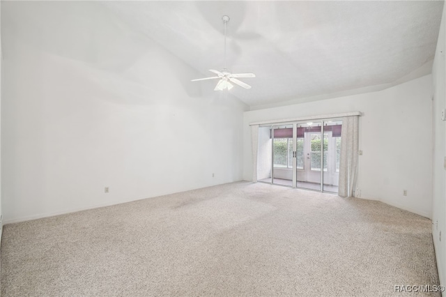 spare room with carpet flooring, ceiling fan, and lofted ceiling