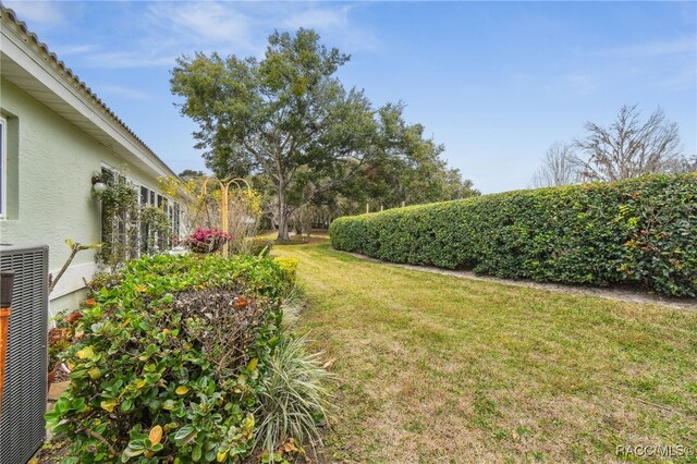 view of yard featuring central AC