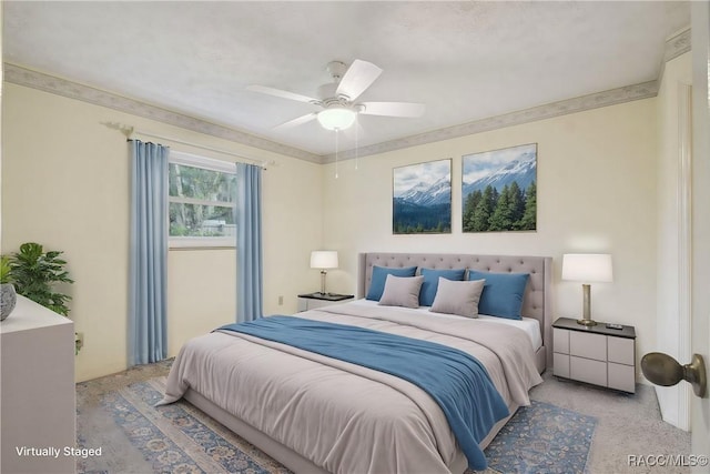 carpeted bedroom with ceiling fan