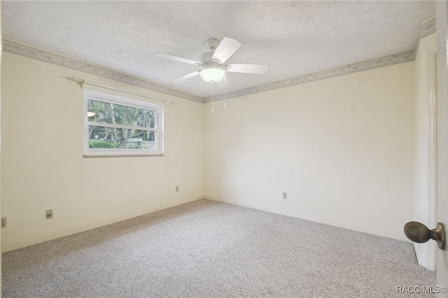 unfurnished room featuring carpet, ceiling fan, and a textured ceiling