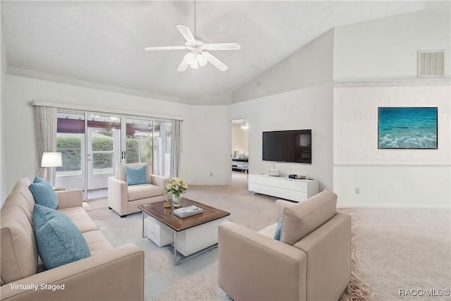 living room featuring light carpet, high vaulted ceiling, and ceiling fan