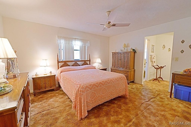 carpeted bedroom with a ceiling fan