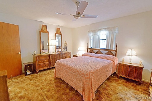 bedroom with ceiling fan and carpet flooring